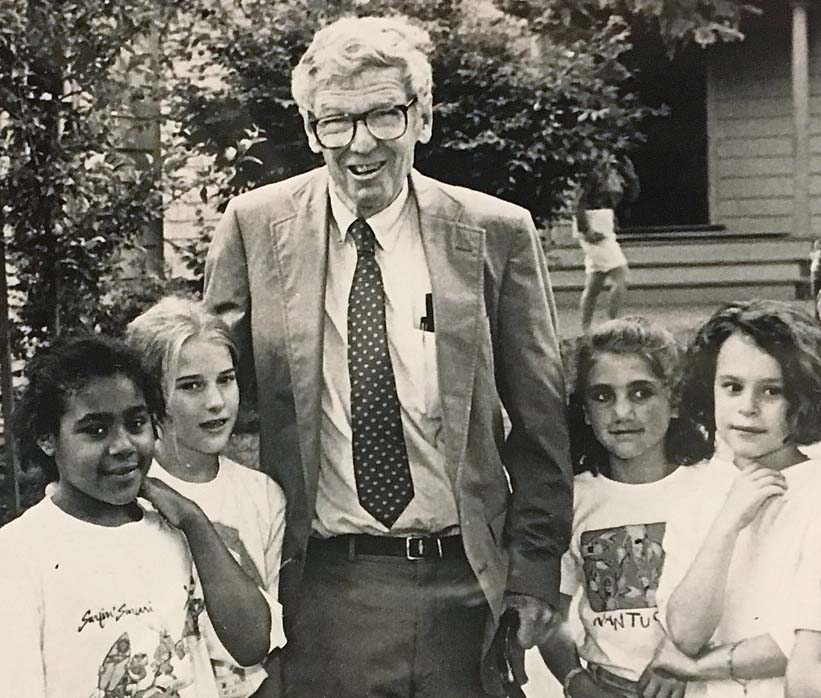sepia photo of man with students