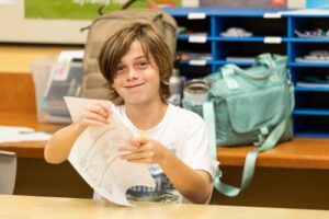 Middle School student smiling at the camera