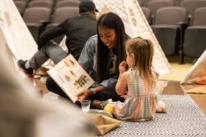 Teacher reading to young child