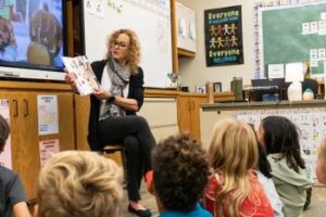 Head of School reading to Children